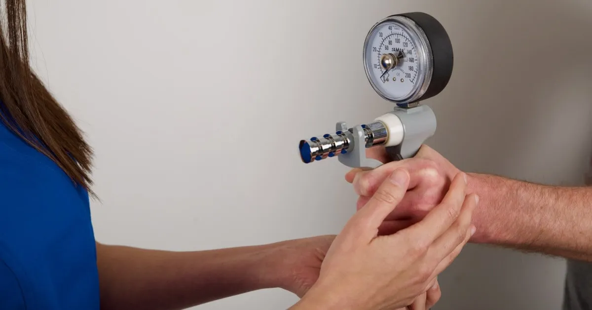 Ms Michelle Razo using a Jamar dynamometer to measure grip strength during a Hand Therapy assessment
